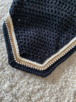 Black U-shape with beige details